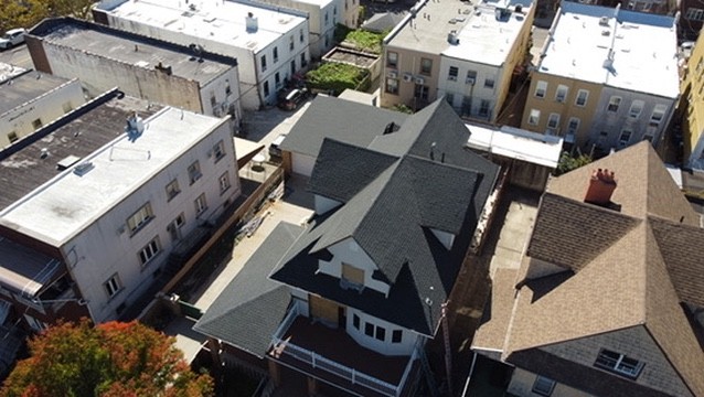 Aerial view of attached Brooklyn row house roofs meeting at shared party walls