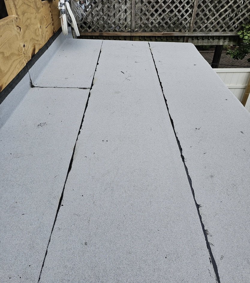 Finished modified bitumen flat roof with granulated cap sheet in Brooklyn
