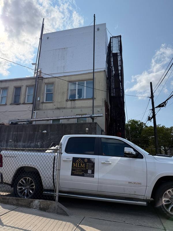 MLM truck jobsite stucco progress Brooklyn