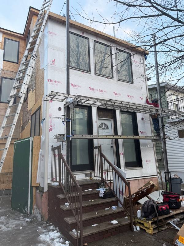 Board and Batten CertainTeed siding installation progress