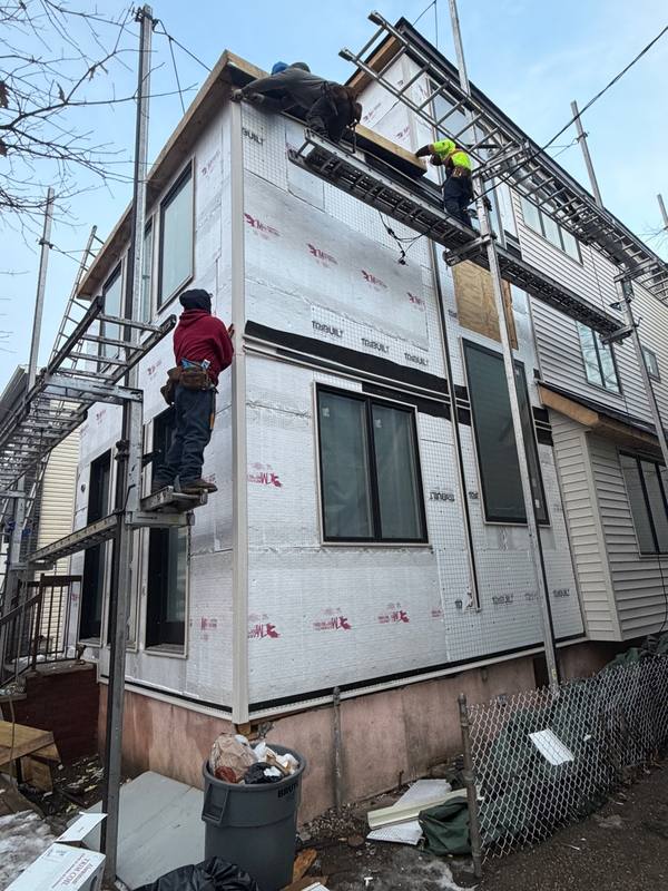 Siding panels installed scaffold Brooklyn