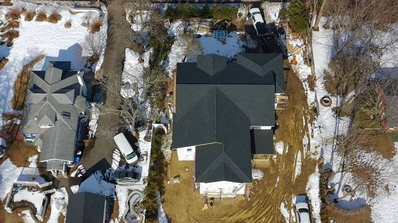 Completed dark shingle roof NJ aerial drone view