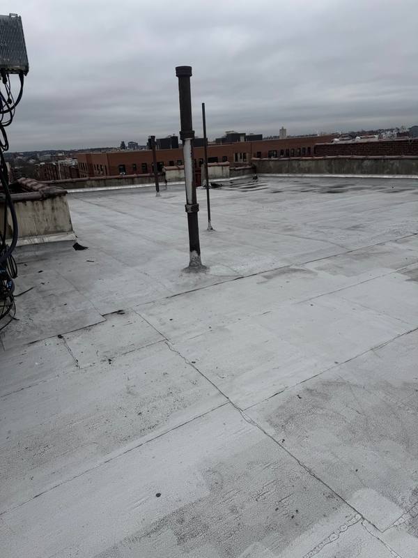Cracked flat roof Queens NY before replacement