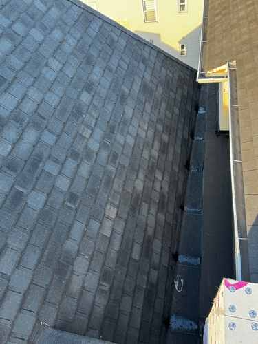 Dark shingle roof installed MLM
