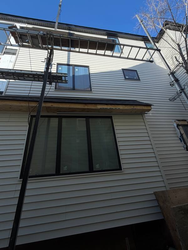 Side view siding installation progress Brooklyn