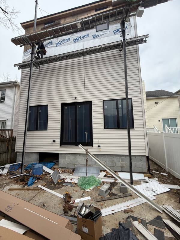 Home before siding installation Brooklyn NY plywood sheathing