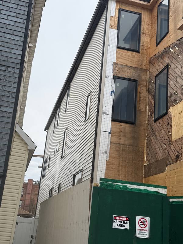 Exposed plywood before Board and Batten siding Brooklyn