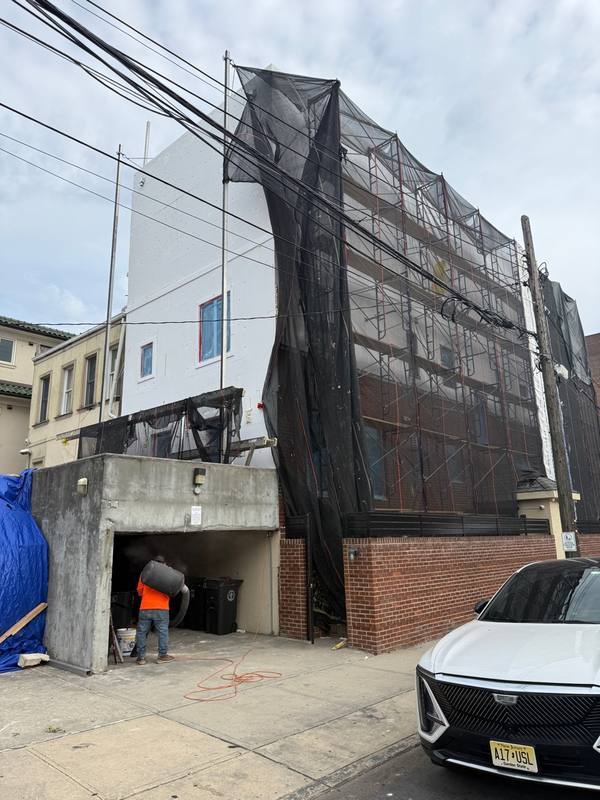 Stucco nearly completed scaffold still up