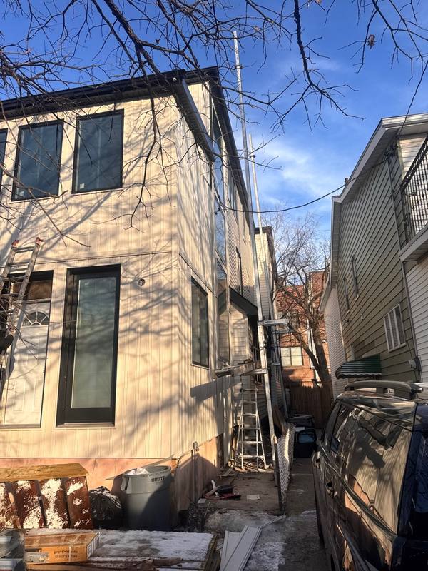 New Board and Batten siding side view completed Brooklyn