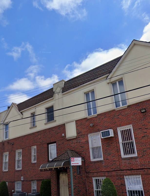 Deteriorated stucco exterior before renovation