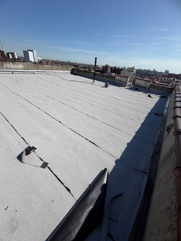 New white flat roof completed Queens NY MLM Construction