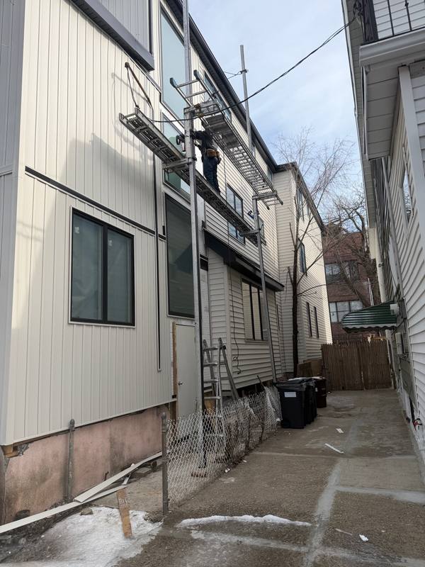 Finished exterior siding shingle roof Brooklyn home